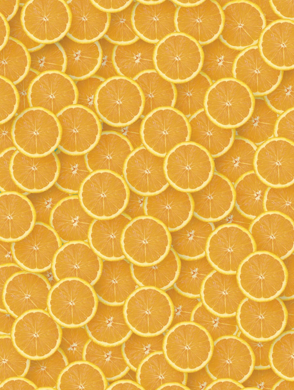 Top view of many orange fruit slices as a background image. A saturated citrus pattern. Flat lay